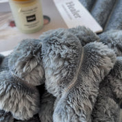 plaid cocooning gris avec texture douce et confortable