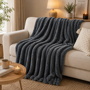 plaid pilou cocon de douceur ultra moelleux sur fauteuil