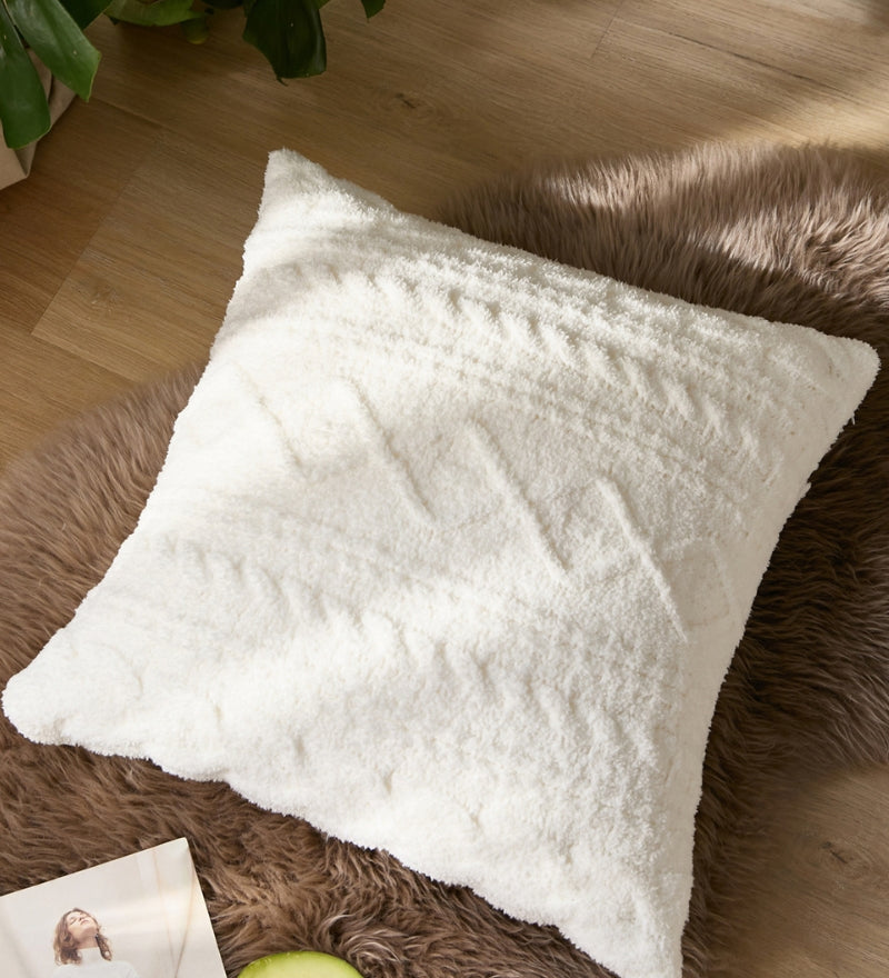 Coussin en matière toute douce de couleur blanche