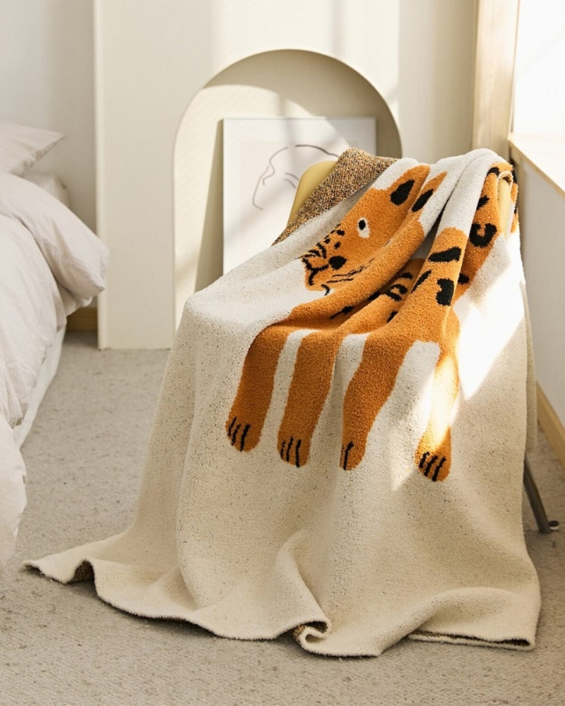 Plaid beige avec motif en matière très douce