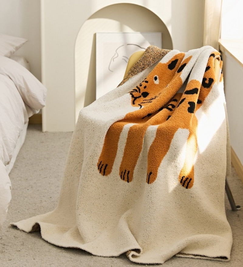 Plaid beige avec motif en matière très douce