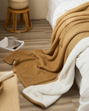 Plaid en fausse fourrure de couleur marron