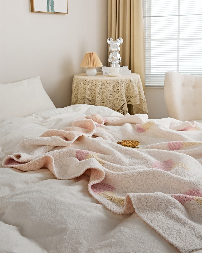 Plaid matelassé rose pâle à motif