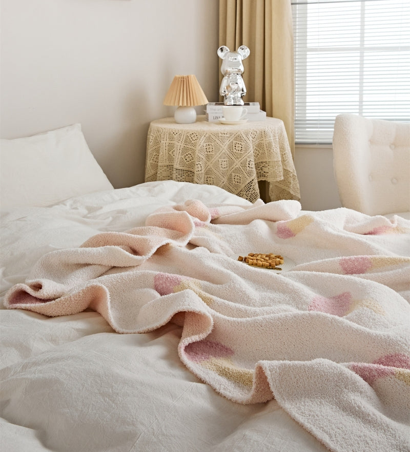 Plaid matelassé rose pâle à motif